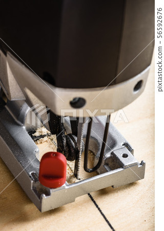 Jig saw cutting plywood 56592676