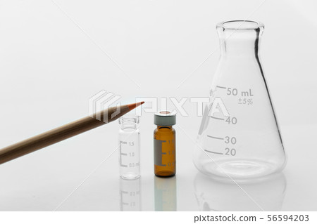 wood orange pencil and science glass flask wood orange pencil and science glass flask 56594203