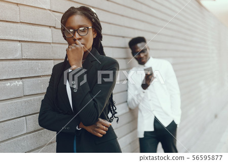 Elegant black couple in a summer city Elegant black couple in a summer city 56595877