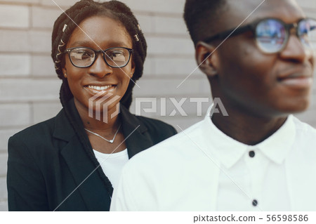 Elegant black couple in a summer city 56598586