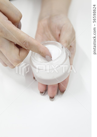 Women's hand holding cream Women's hand holding cream 56598624