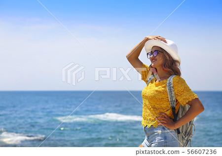Female tourist wanderlust with backpack wearing Female tourist wanderlust with backpack wearing 56607236