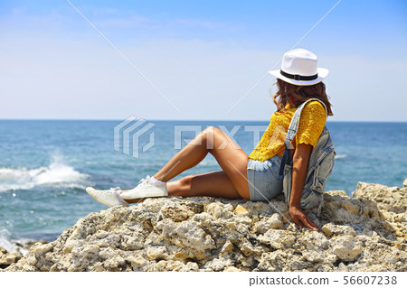 Female tourist wanderlust with backpack wearing Female tourist wanderlust with backpack wearing 56607238