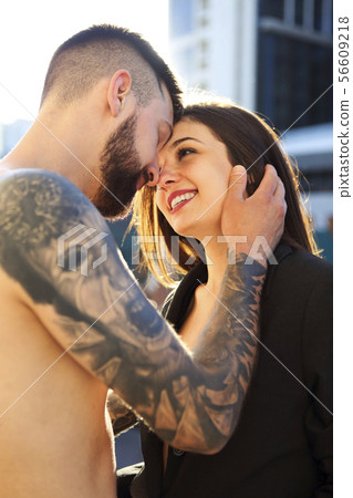 Young tattooed stylish couple in love Young tattooed stylish couple in love 56609218
