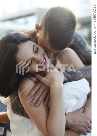 Young tattooed stylish couple in love Young tattooed stylish couple in love 56609219