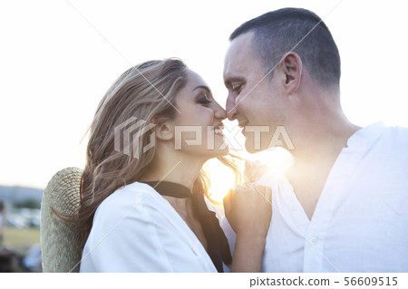 Cute young happy couple in love in a field of 56609515