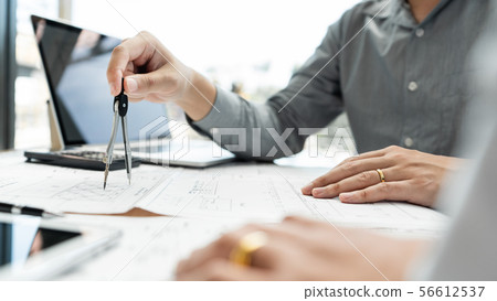 Confident engineer team working with Blue Print Confident engineer team working with Blue Print 56612537