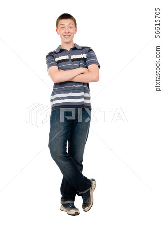 Cheerful young man with arms crossed in full Cheerful young man with arms crossed in full 56615705
