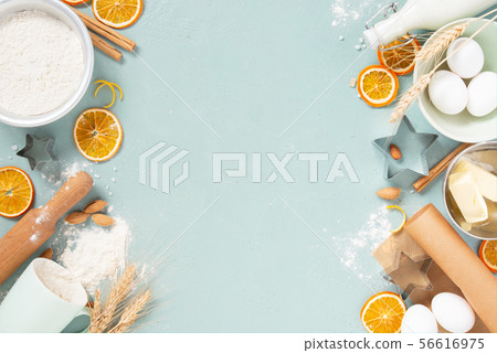Blue background with raw ingredients for baking, Blue background with raw ingredients for baking, 56616975