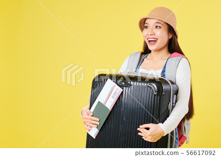 Happy woman with baggage Happy woman with baggage 56617092