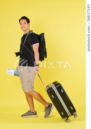 Tourist walking with suitcase Tourist walking with suitcase 56617143