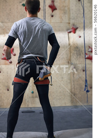 Back view of physically challenged climber taking out some chalk out of bag Back view of physically challenged climber taking out some chalk out of bag 56620146