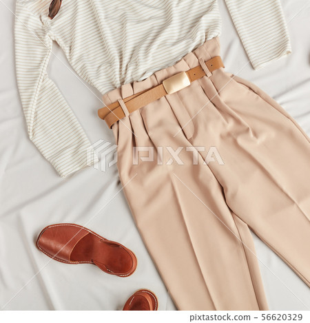 girl has bought fashionable clothes in the shopping mall 56620329