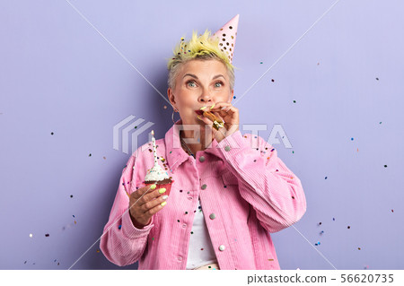 old granny entertaining her grandsons and granddaughters old granny entertaining her grandsons and granddaughters 56620735