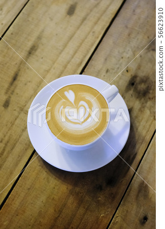 Cups of cafe latte on wooden table background 56623910