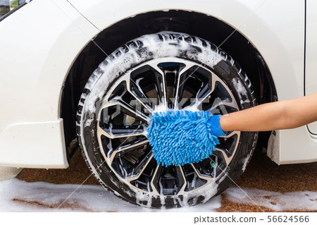 Woman hand with blue microfiber fabric washing  56624566