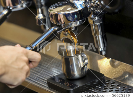 Espresso pouring from coffee machine 56625189
