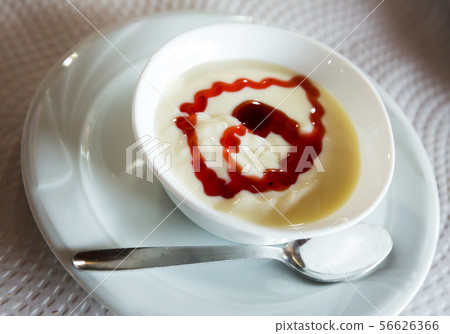 Natillas with berry sauce 56626366