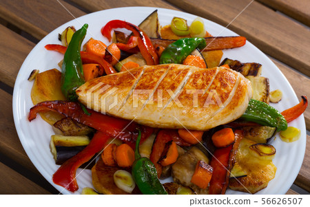 Bulgarian dish plakia, fried chicken fillet tasty baked vegetables 56626507