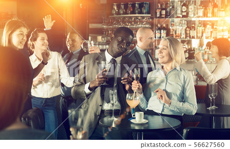 Afro man and Caucasian woman having conversation Afro man and Caucasian woman having conversation 56627560