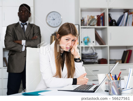 Offended woman after quarrel in office 56627561