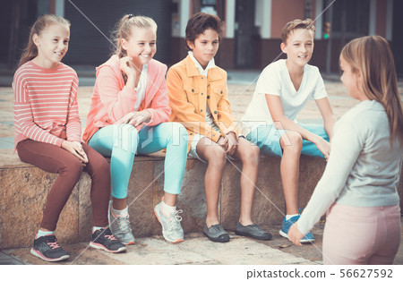 boys and girls are communicating outdoor boys and girls are communicating outdoor 56627592