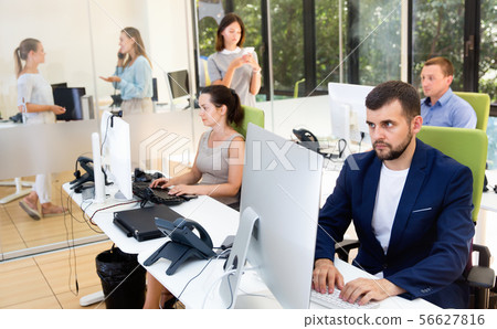 Group of successful business people during daily work in modern co-working space 56627816