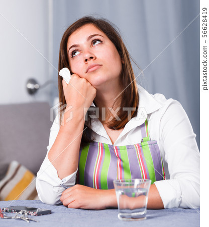 Woman feeling sad 56628419