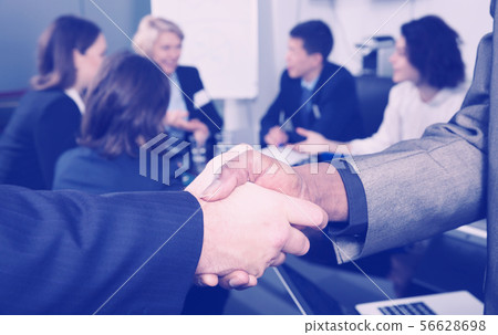 Closeup of international handshake Closeup of international handshake 56628698