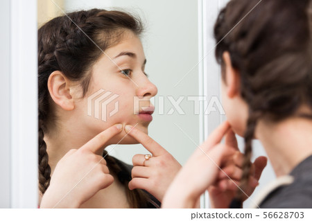 Girl cleaning pores 56628703