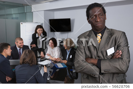 Discontent African American businessman in meeting room Discontent African American businessman in meeting room 56628706