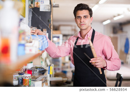 Joiner looking for necessary tools 56628934