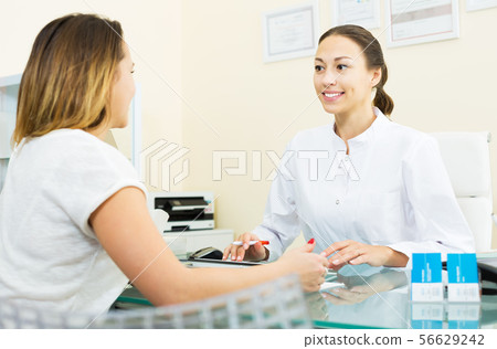 Consultation in aesthetic medicine center 56629242