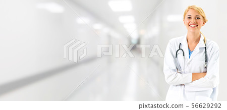 Woman doctor working at the hospital office. 56629292