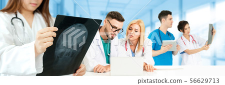 Doctor working in hospital with other doctors. Doctor working in hospital with other doctors. 56629713
