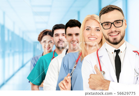 Doctor working in hospital with other doctors. Doctor working in hospital with other doctors. 56629775