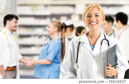 Doctor working in hospital with other doctors. Doctor working in hospital with other doctors. 56629837