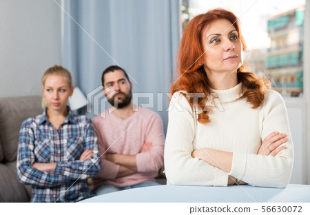 Young serious couple has a family stressful conversation at home Young serious couple has a family stressful conversation at home 56630072