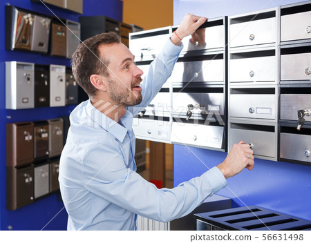 Man looking for mailbox Man looking for mailbox 56631498