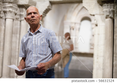 Man with guidebook at Art Museum 56631524