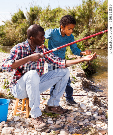 Fishermen - boy and his father Fishermen - boy and his father 56631889