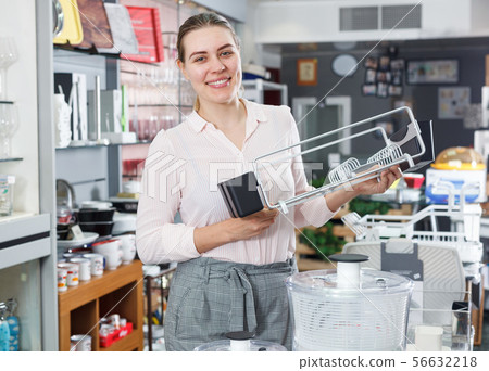 Female buyer choosing kitchen rack in the tableware store 56632218