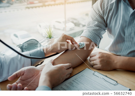 Doctor using stethoscope take a tap on the Doctor using stethoscope take a tap on the 56632740
