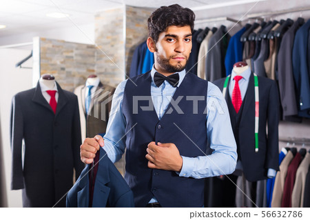 Man is demonstrating image in waistcoat with butterfly Man is demonstrating image in waistcoat with butterfly 56632786