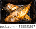 cooked headless mackerel in a black plastic container 56635897