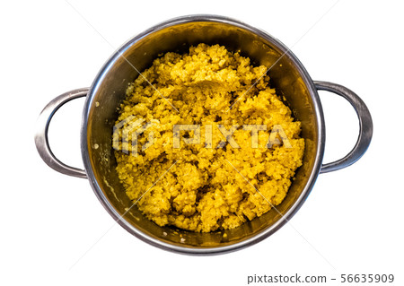 cooked steamed orange quinoa grits in a pan isolated on white background 56635909