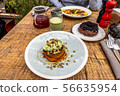 Breakfast in the cafe with sweet potato pancakes, matcha latte, curd ring. 56635954