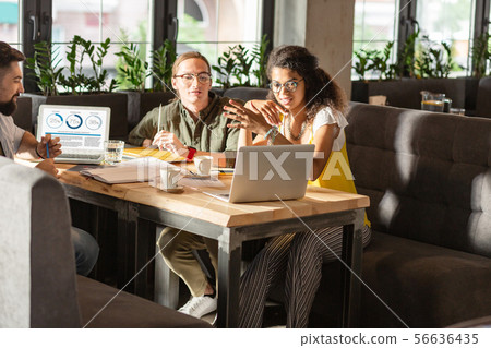 Nice smart people looking at the laptop screen Nice smart people looking at the laptop screen 56636435
