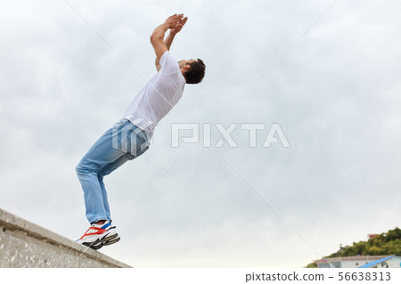 handsome strong man going to do a stunt handsome strong man going to do a stunt 56638313
