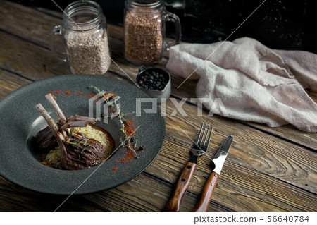 Rack of lamb with polenta. Low key, copyspace, rustic style 56640784